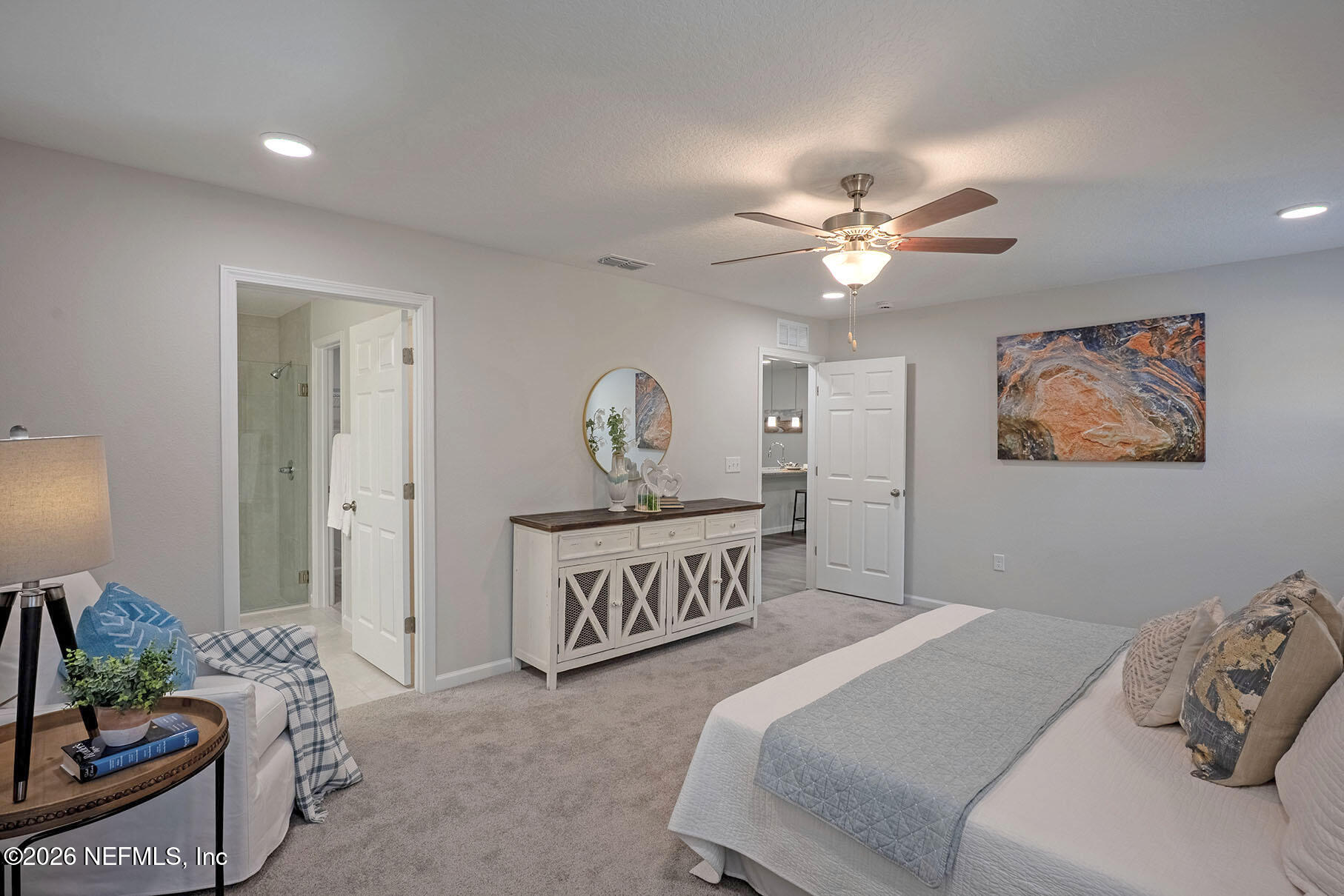 1639 Lakewood Road Jacksonville, FL 32207 - Photo 31 of 39 a bedroom with a bed and a chandelier