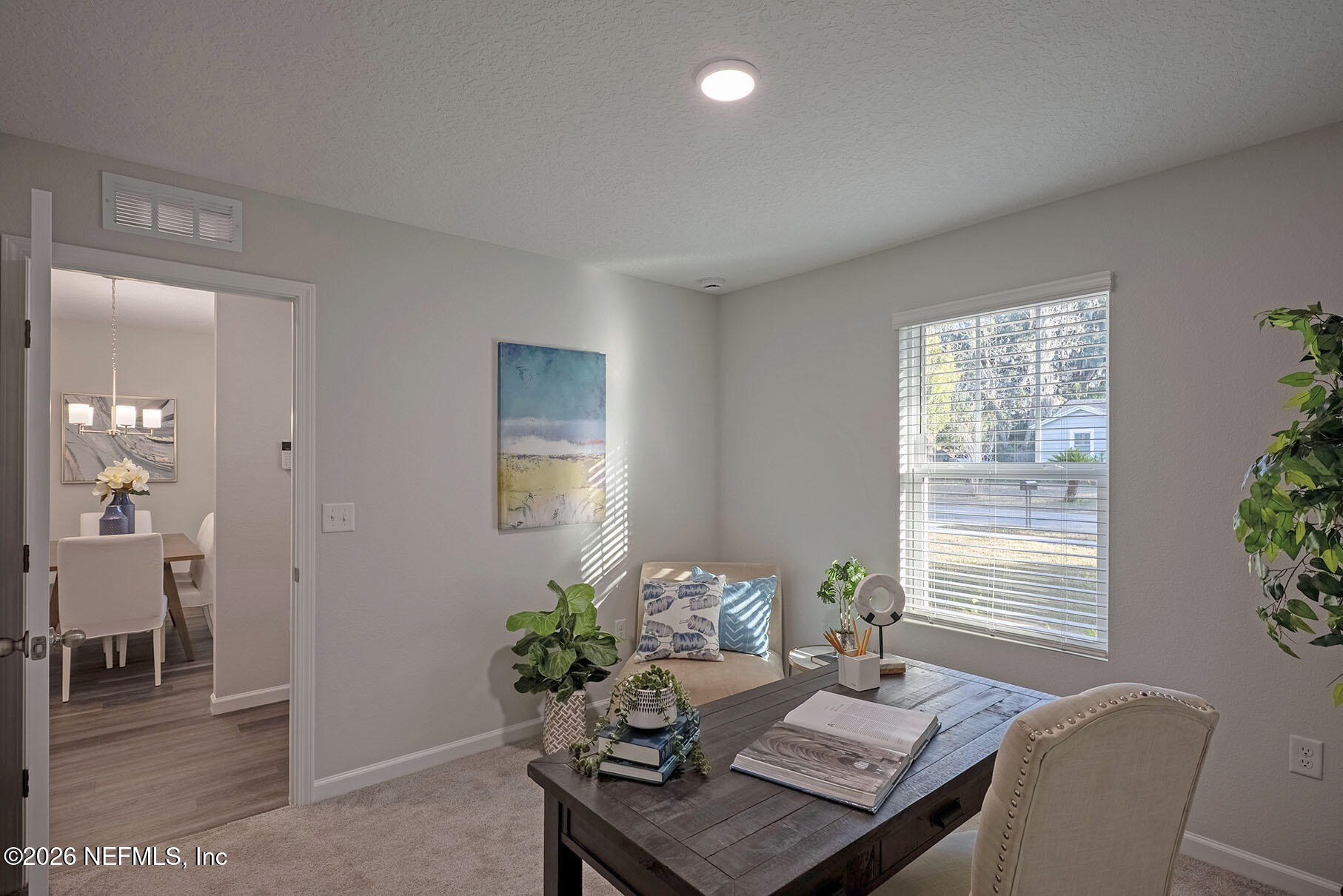 1639 Lakewood Road Jacksonville, FL 32207 - Photo 6 of 39 a view of a workspace with furniture and a potted plant