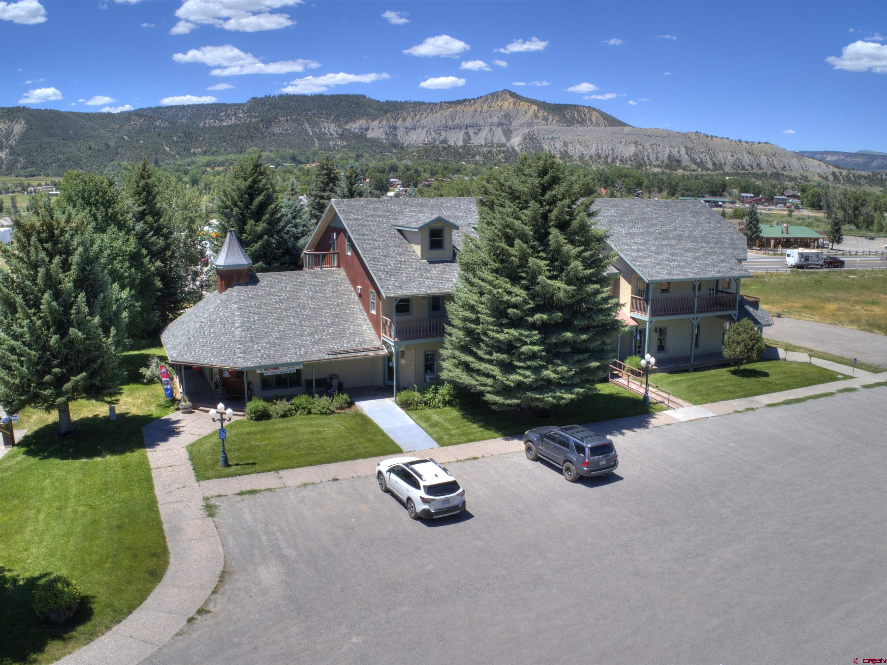 112 Village Square West Ridgway, CO 81432 - Photo 2 of 16 an aerial view of a house with yard and outdoor seating