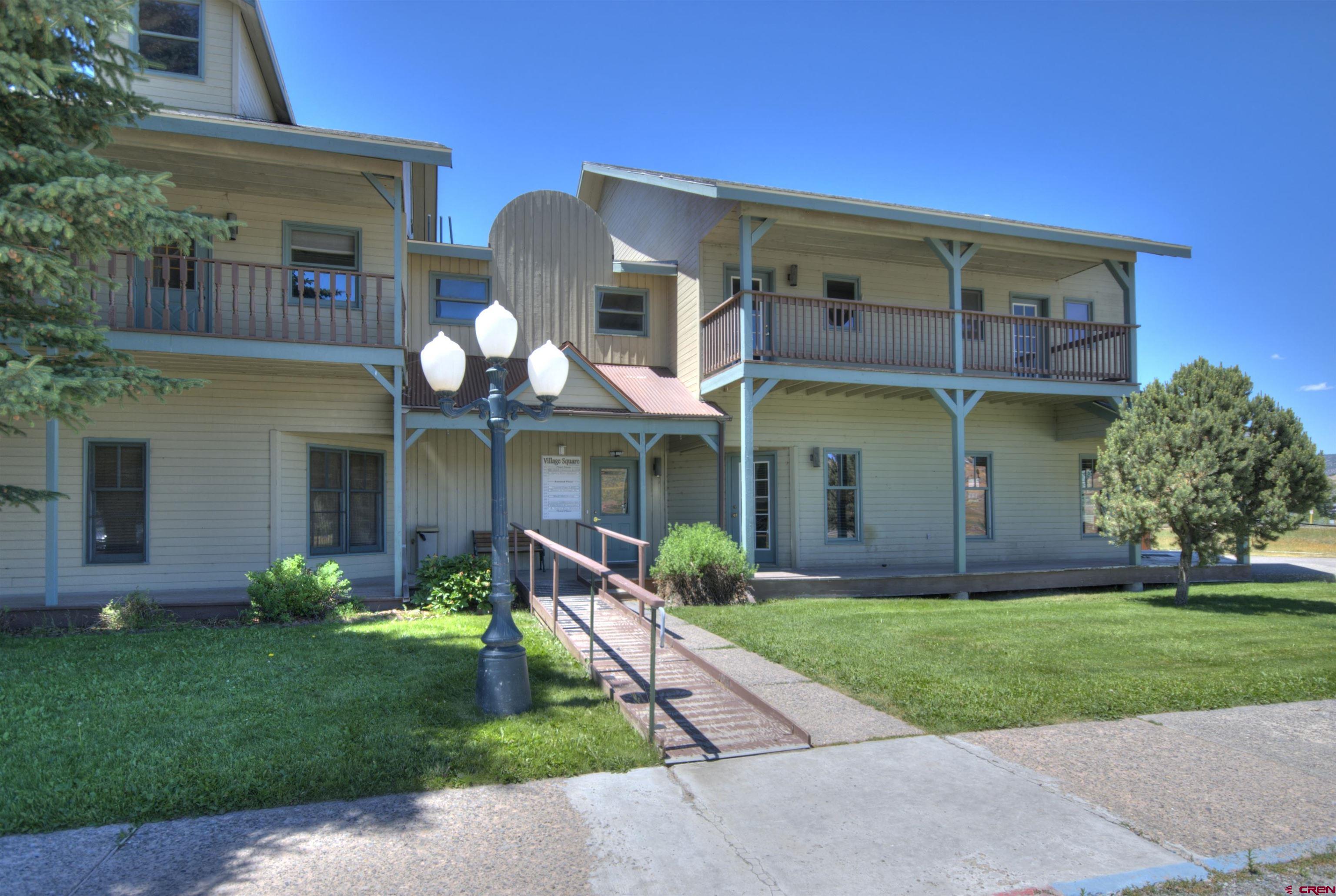 112 Village Square West Ridgway, CO 81432 - Photo 7 of 16 front view of a house with a yard
