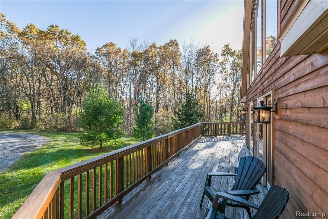 277 North Baldwin Road Oxford, MI 48371 - Photo 38 of 45 WRAP-AROUND DECK - FACING CIRCLE DRIVE
