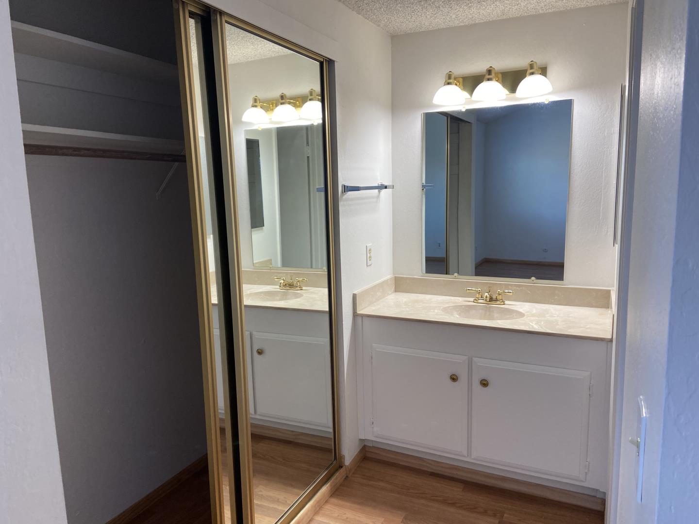 715 Comet Drive Foster City, CA 94404 - Photo 16 of 25 a bathroom with a double vanity sink and mirror