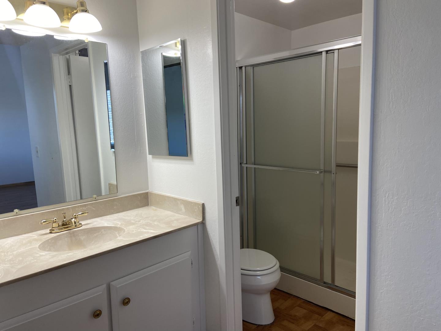 715 Comet Drive Foster City, CA 94404 - Photo 17 of 25 a bathroom with a granite countertop sink toilet and shower