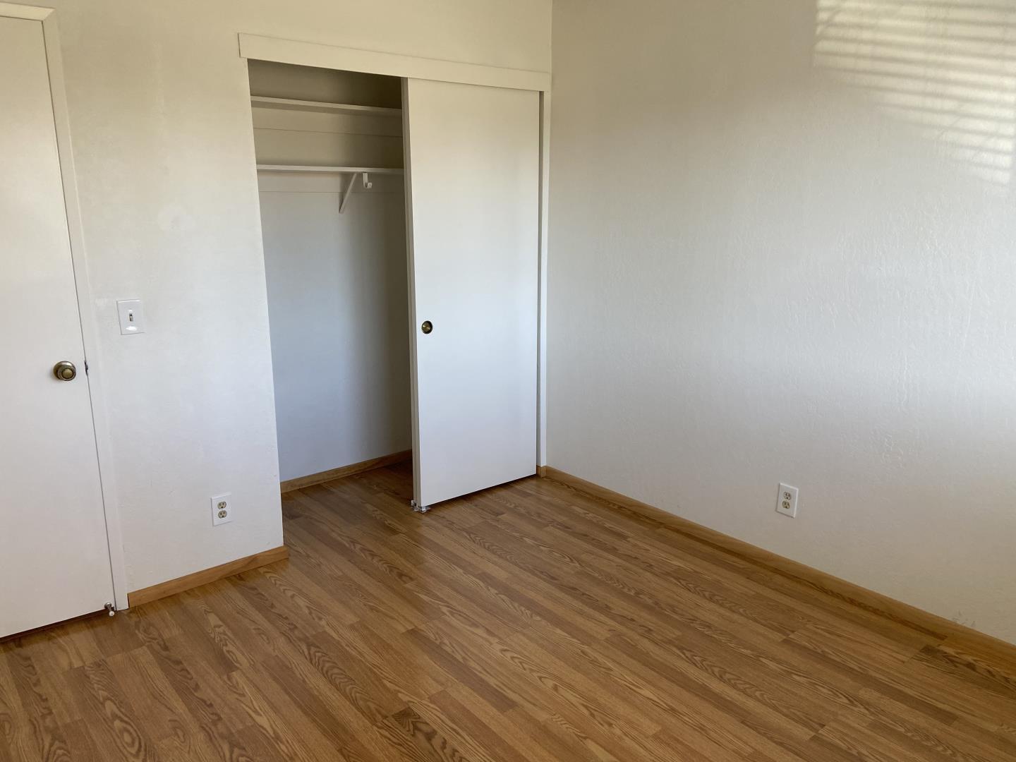 715 Comet Drive Foster City, CA 94404 - Photo 19 of 25 a view of an empty room with wooden floor and closet