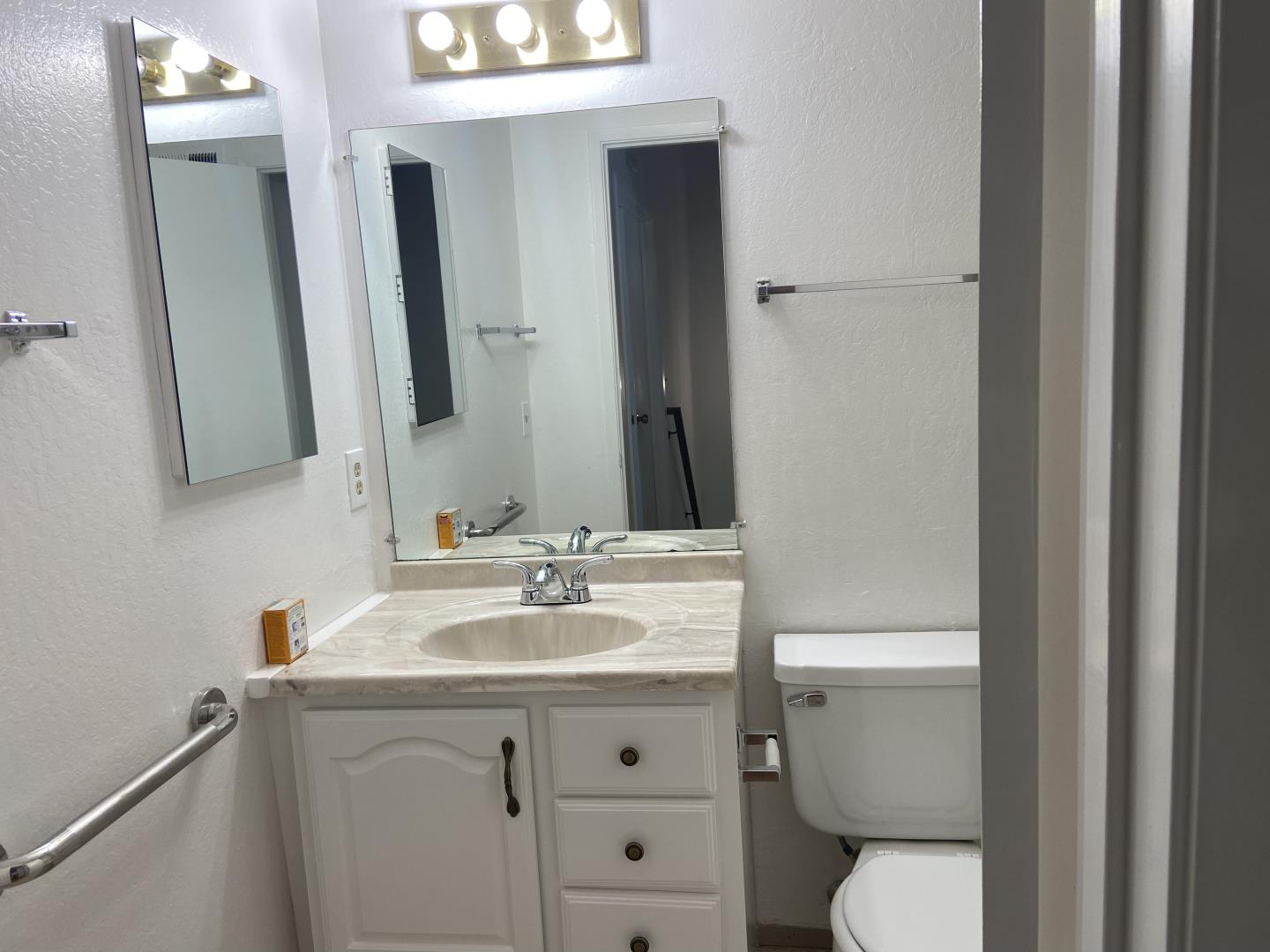715 Comet Drive Foster City, CA 94404 - Photo 20 of 25 a bathroom with a sink toilet and mirror