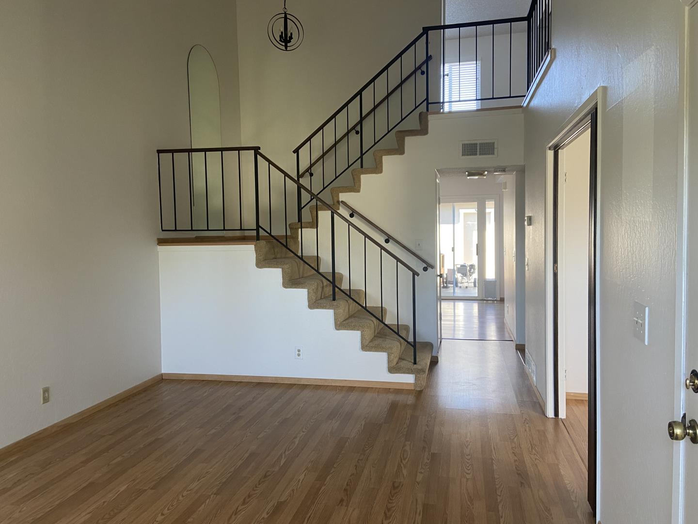 715 Comet Drive Foster City, CA 94404 - Photo 3 of 25 a view of staircase with wooden floor and white walls