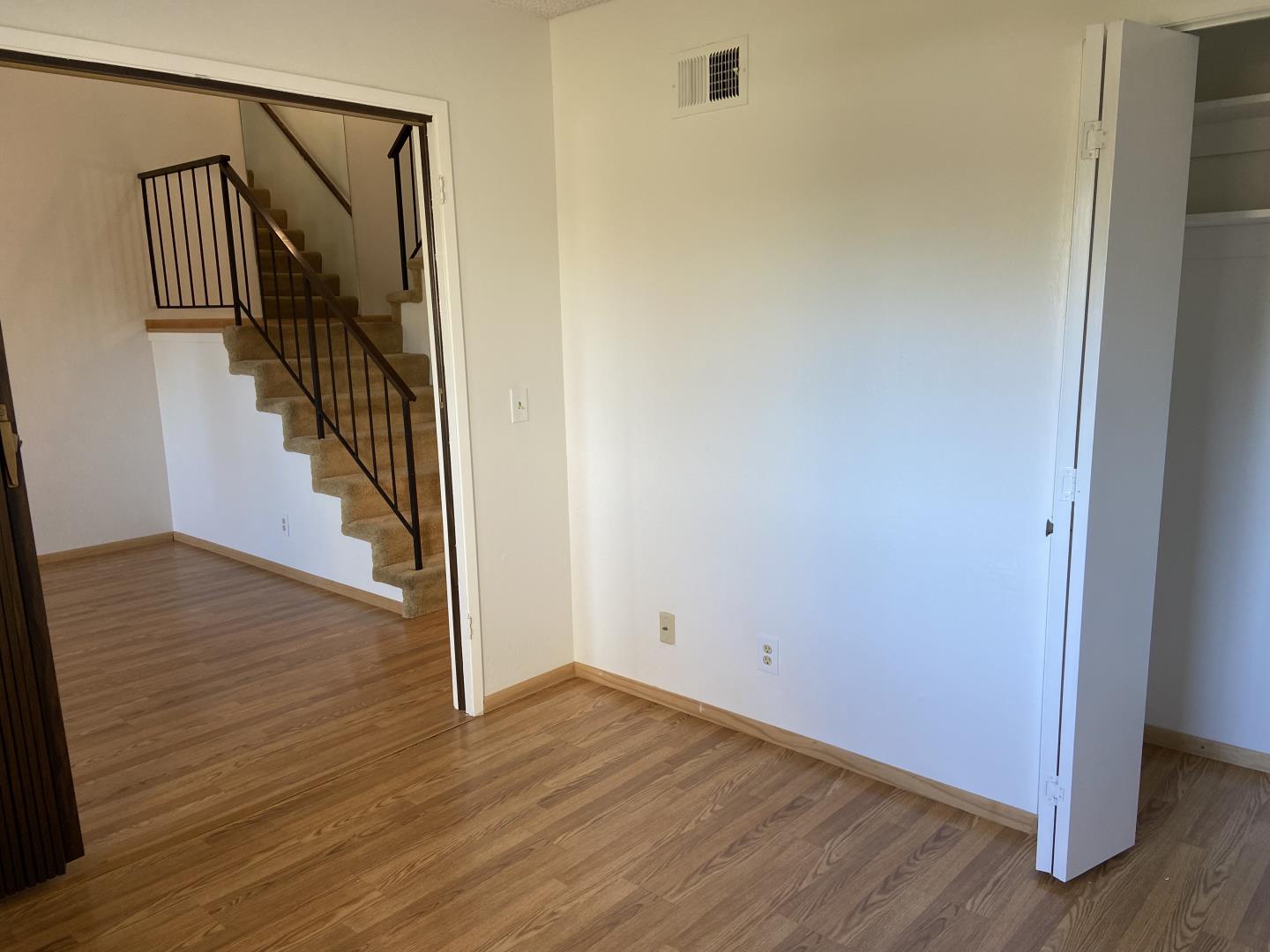 715 Comet Drive Foster City, CA 94404 - Photo 6 of 25 a view of a hallway with wooden floor and entryway