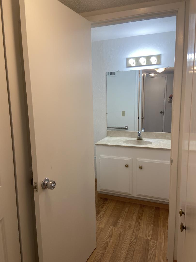 715 Comet Drive Foster City, CA 94404 - Photo 8 of 25 a bathroom with a sink and mirror