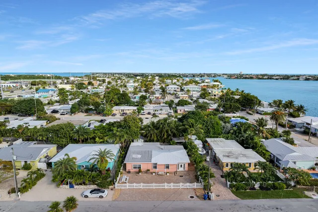 an aerial view of a house with a lake view