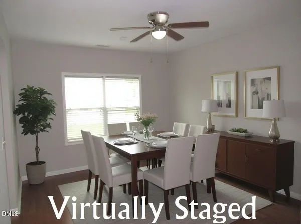 a view of a dining room with furniture and window