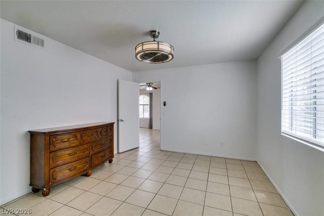 7570 West Flamingo Road, Unit 252 Las Vegas, NV 89147 - Photo 33 of 44 A well-proportioned interior with tiled flooring and ample natural light, creating an inviting atmosphere.