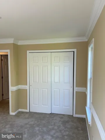 a white bath tub sitting next to a white toilet