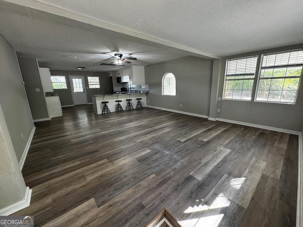 5781 Adams Road Valdosta, GA 31601 - Photo 21 of 27 wooden floor in an empty room with a window