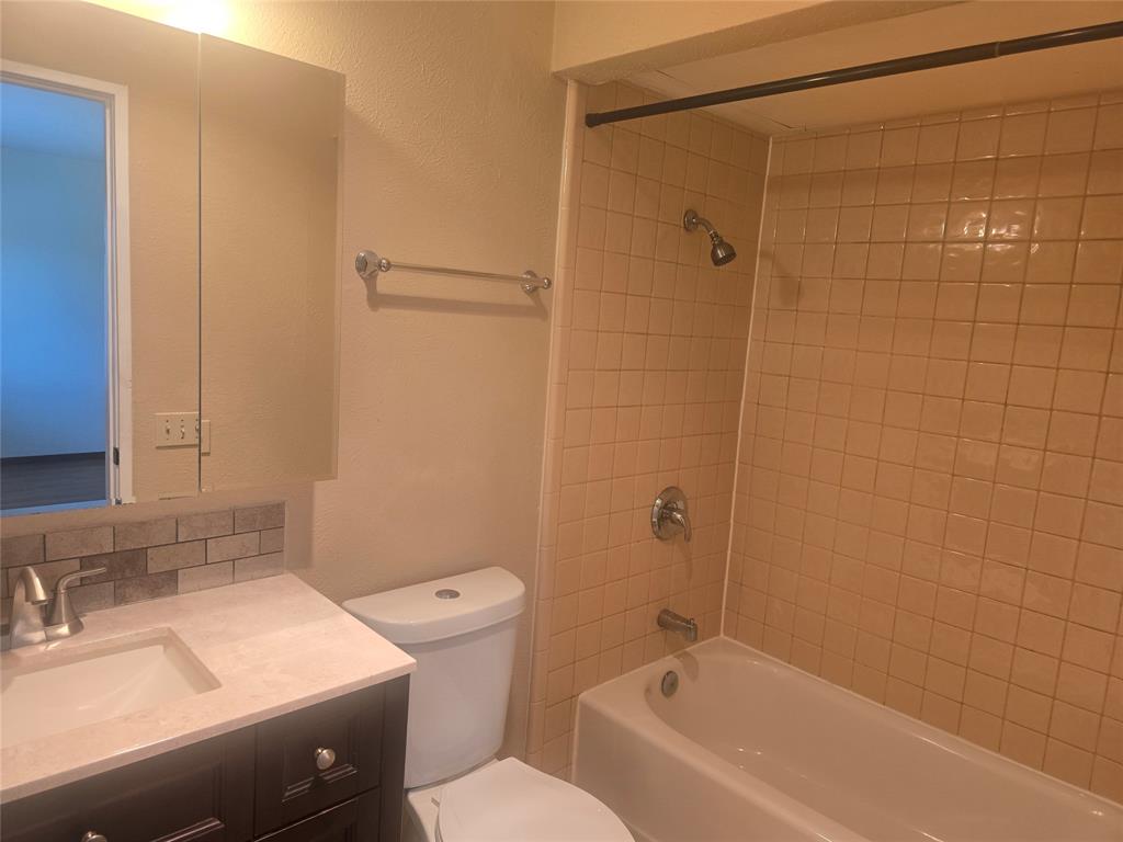 556 Harrison Drive Allen, TX 75002 - Photo 9 of 22 a bathroom with a sink a toilet and shower