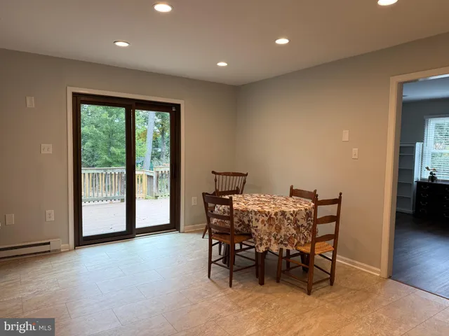a bathroom with a toilet and a shower curtain