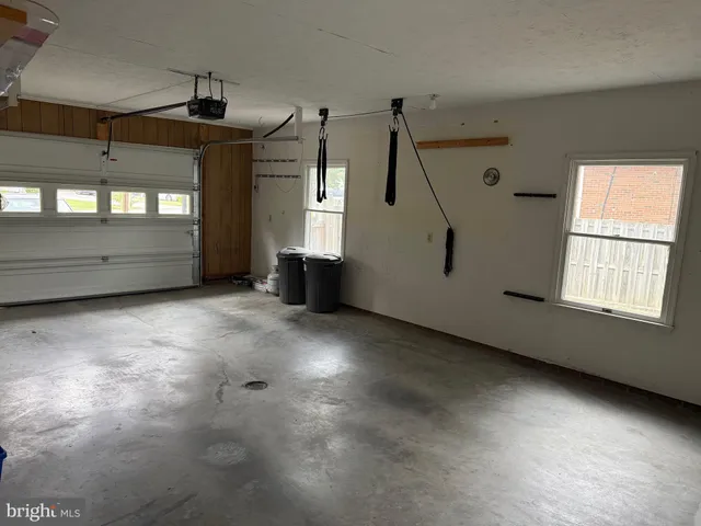 a view of an empty room with a fireplace