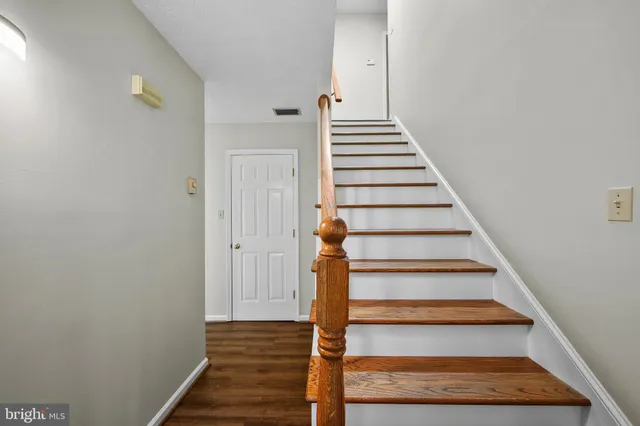 a living room with furniture fireplace and a window