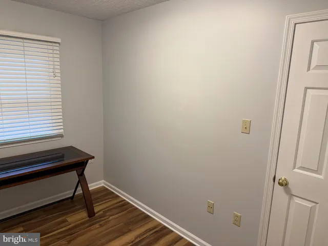 a view of a house with backyard and chairs
