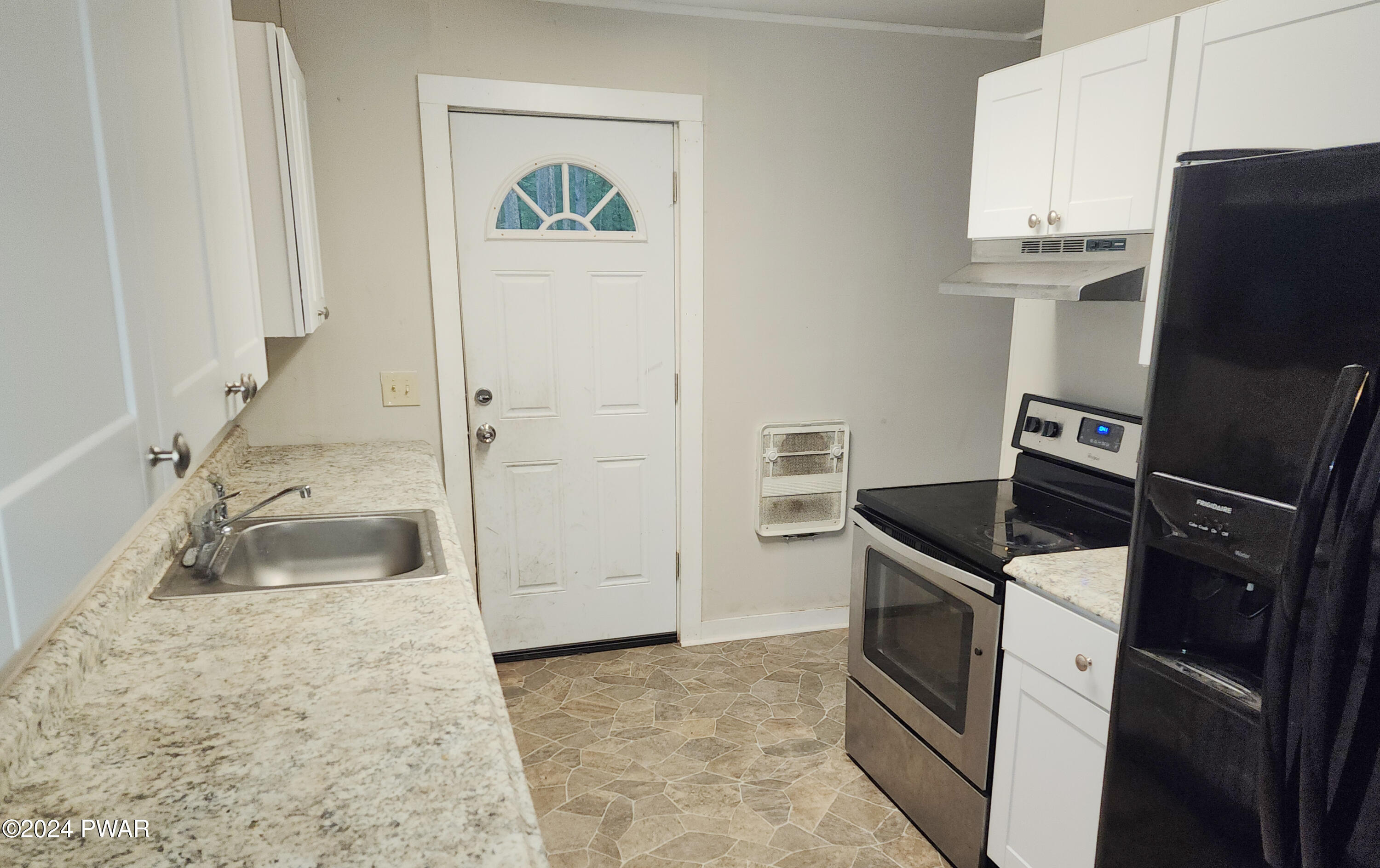 120 Slaymaker Road Milford, PA 18337 - Photo 7 of 28 a kitchen with a refrigerator stove and cabinets