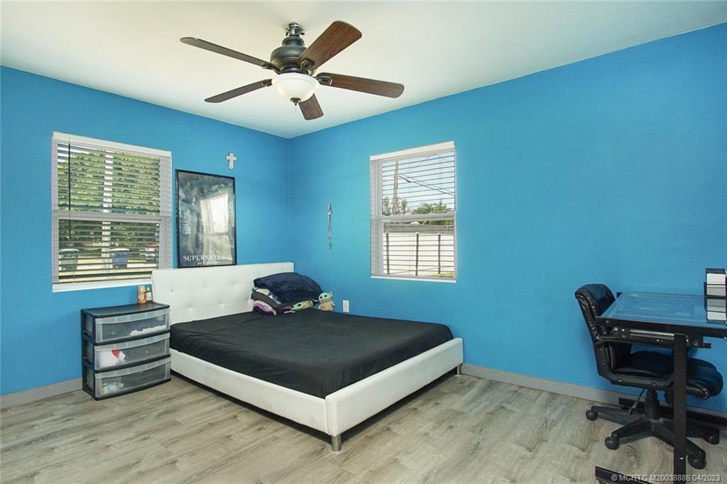 2409 Elizabeth Avenue Fort Pierce, FL 34981 - Photo 16 of 30 a bedroom with a bed and a window