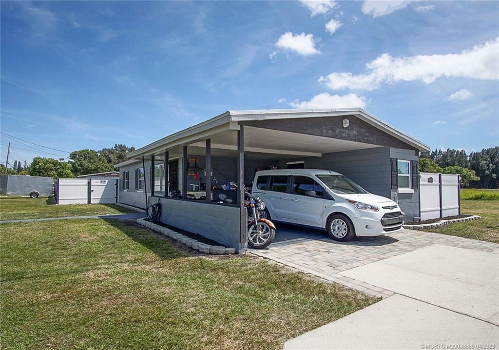2409 Elizabeth Avenue Fort Pierce, FL 34981 - Photo 20 of 30 a view of a car parked in front of a house