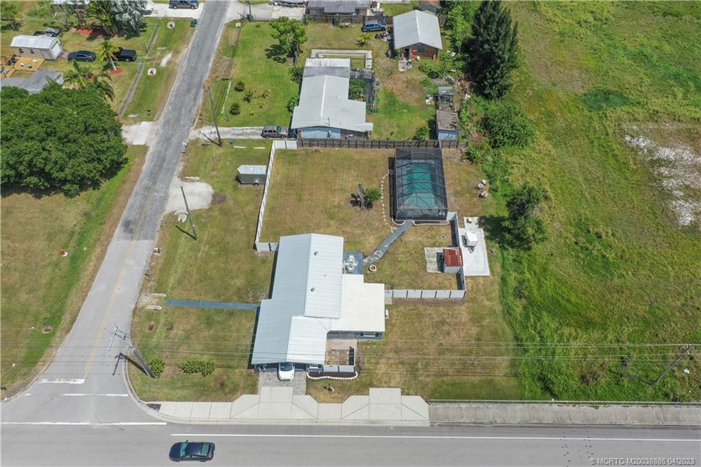 2409 Elizabeth Avenue Fort Pierce, FL 34981 - Photo 2 of 30 an aerial view of residential houses with outdoor space and parking