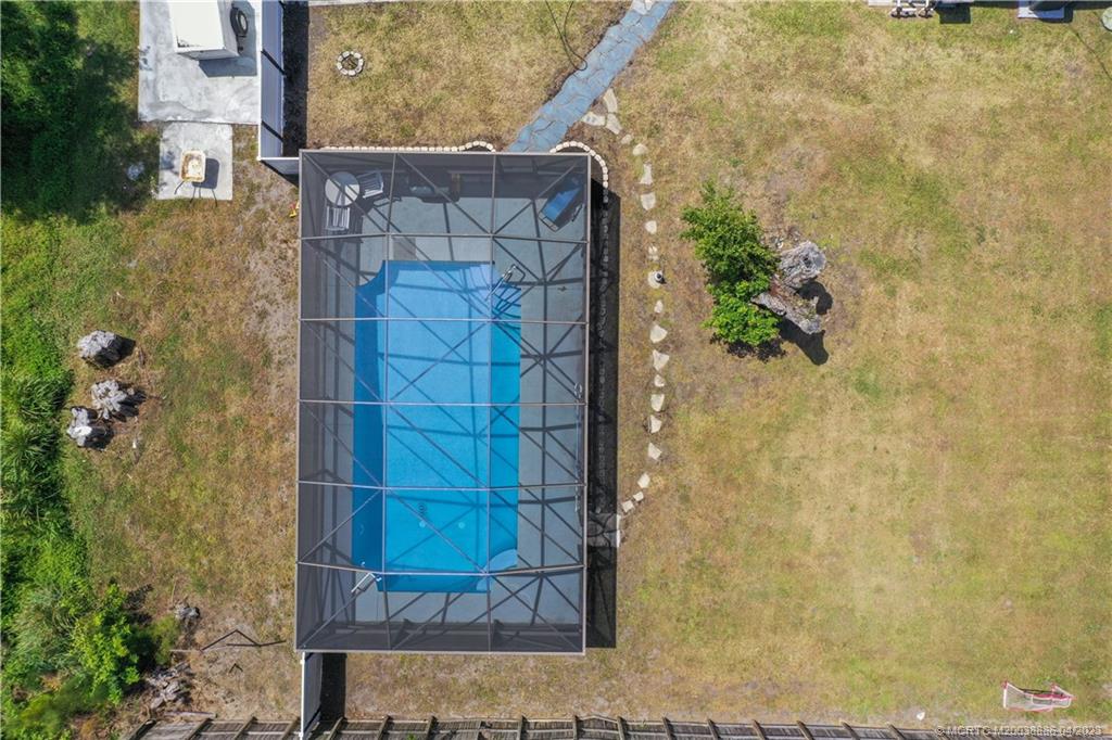 2409 Elizabeth Avenue Fort Pierce, FL 34981 - Photo 22 of 30 a brick building with a glass door