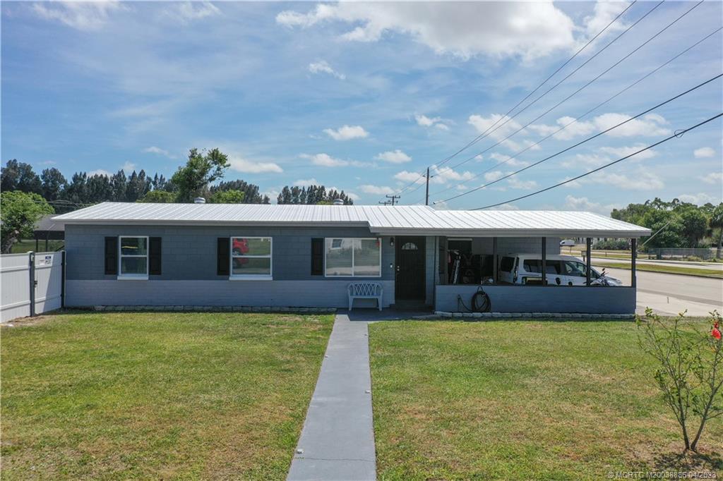 2409 Elizabeth Avenue Fort Pierce, FL 34981 - Photo 24 of 30 a view of a yard with a large pool