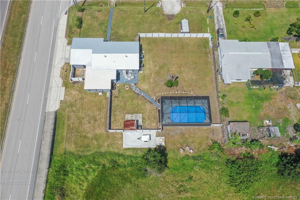 2409 Elizabeth Avenue Fort Pierce, FL 34981 - Photo 3 of 30 an aerial view of residential house with outdoor space and parking
