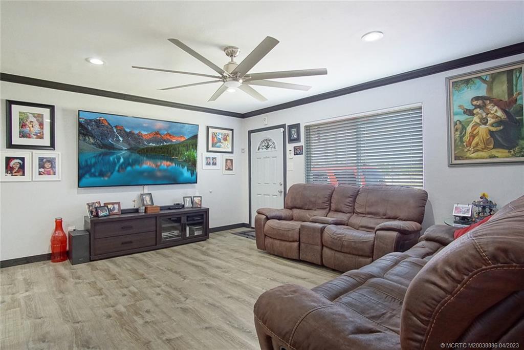 2409 Elizabeth Avenue Fort Pierce, FL 34981 - Photo 9 of 30 a living room with furniture and a flat screen tv