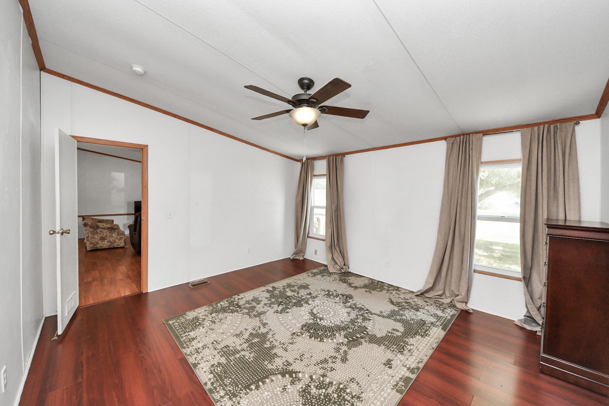 16338 Hill Country Court Conroe, TX 77302 - Photo 13 of 39 wooden floor in an empty room with a window