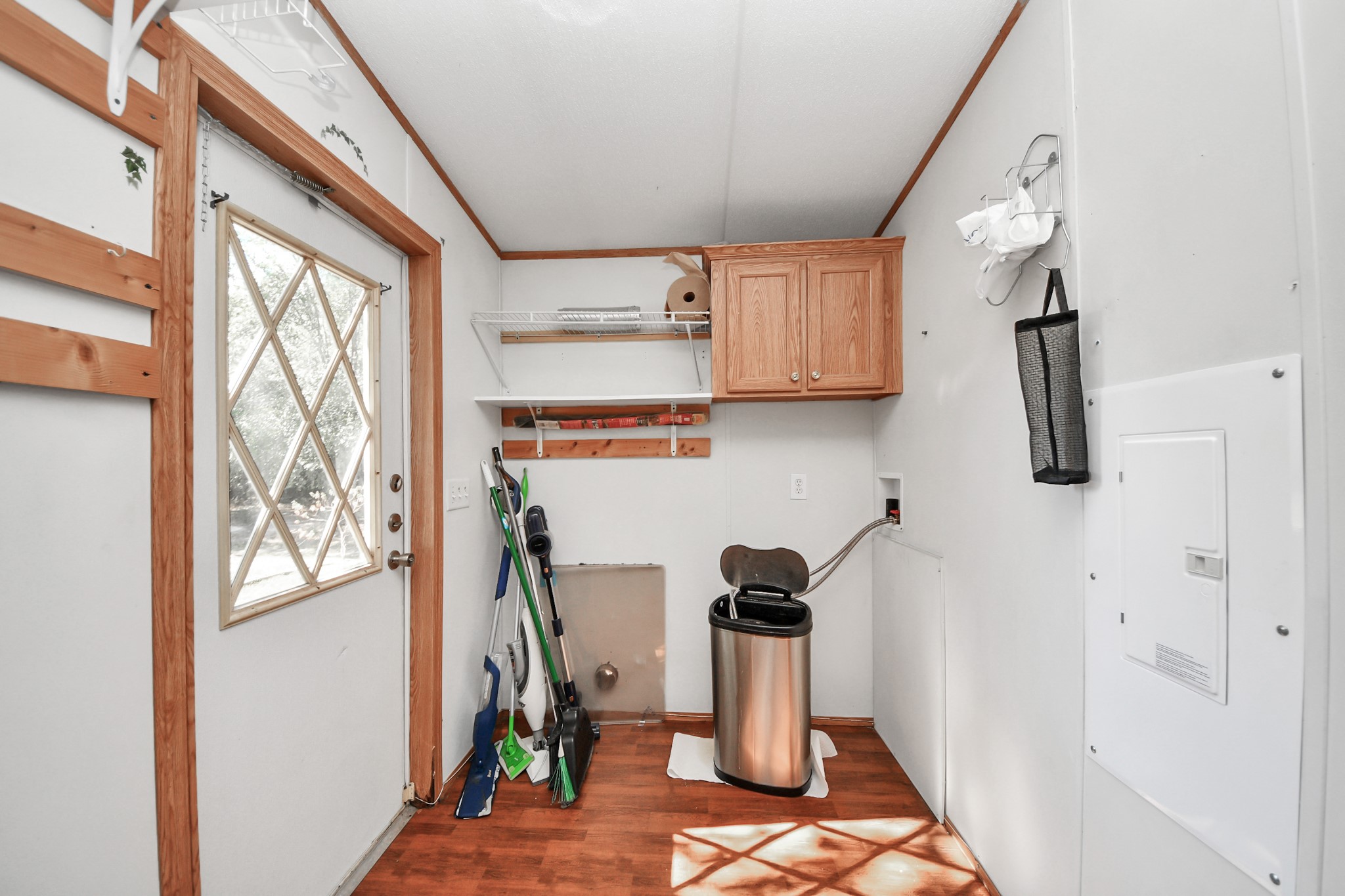 16338 Hill Country Court Conroe, TX 77302 - Photo 16 of 39 a view of storage and utility room with a window