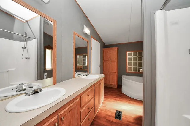 a bathroom with a toilet a sink and a window