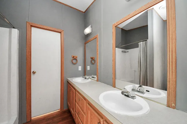 a bathroom with a tub and shower