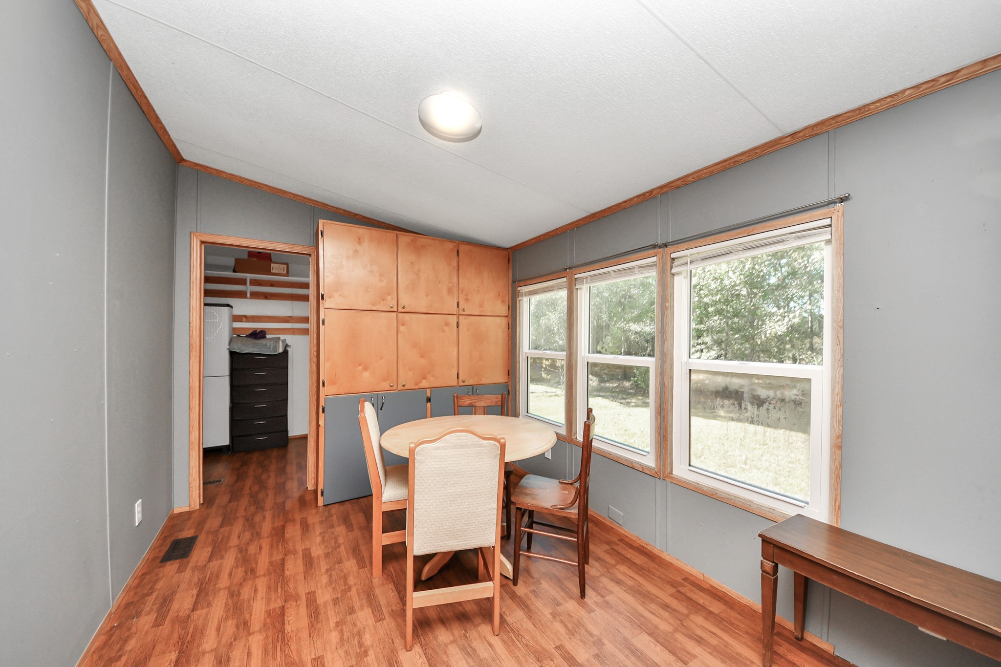 16338 Hill Country Court Conroe, TX 77302 - Photo 30 of 39 a view of a dining room with furniture window and wooden floor