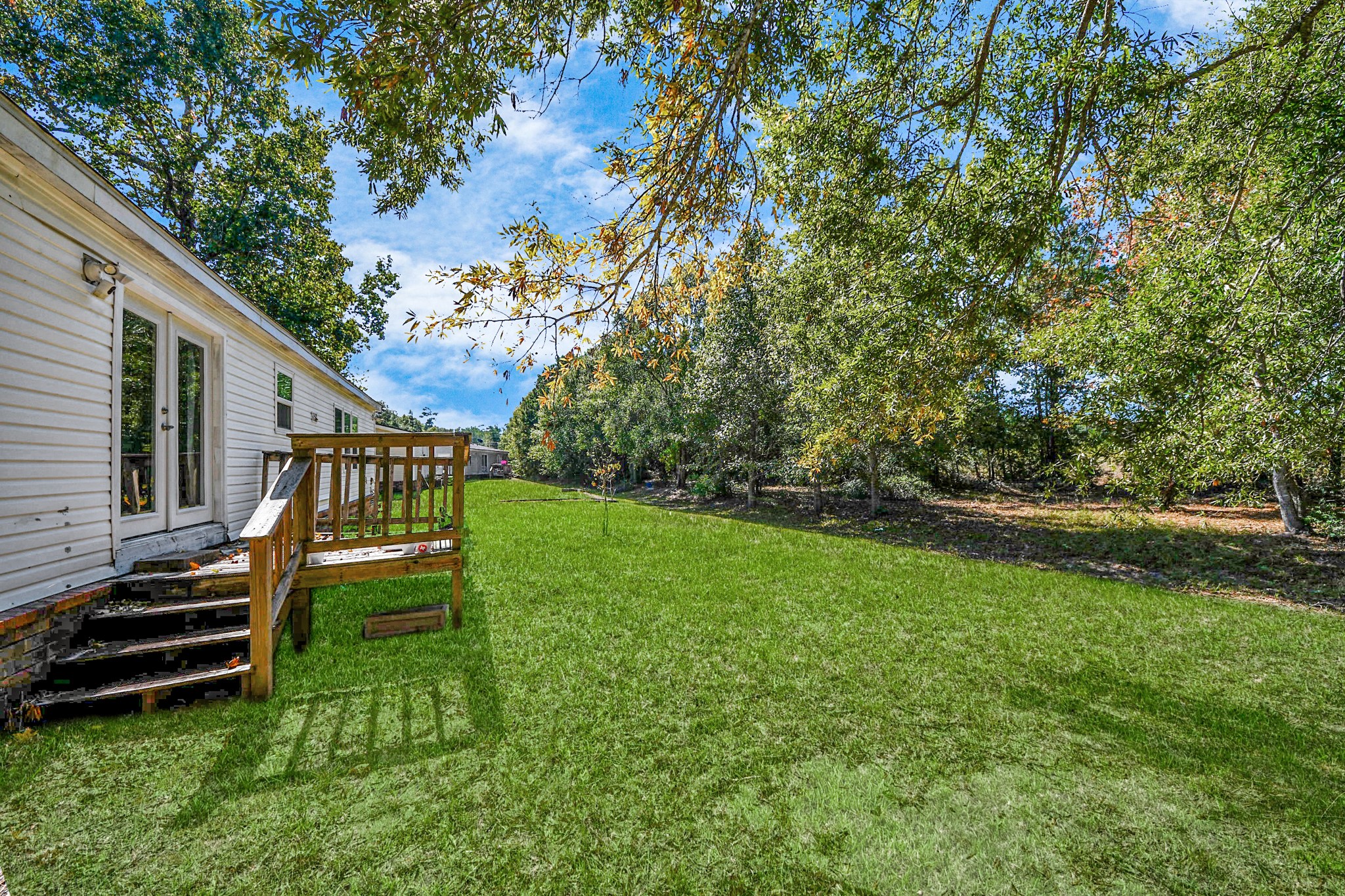 16338 Hill Country Court Conroe, TX 77302 - Photo 35 of 39 a view of a house with a yard