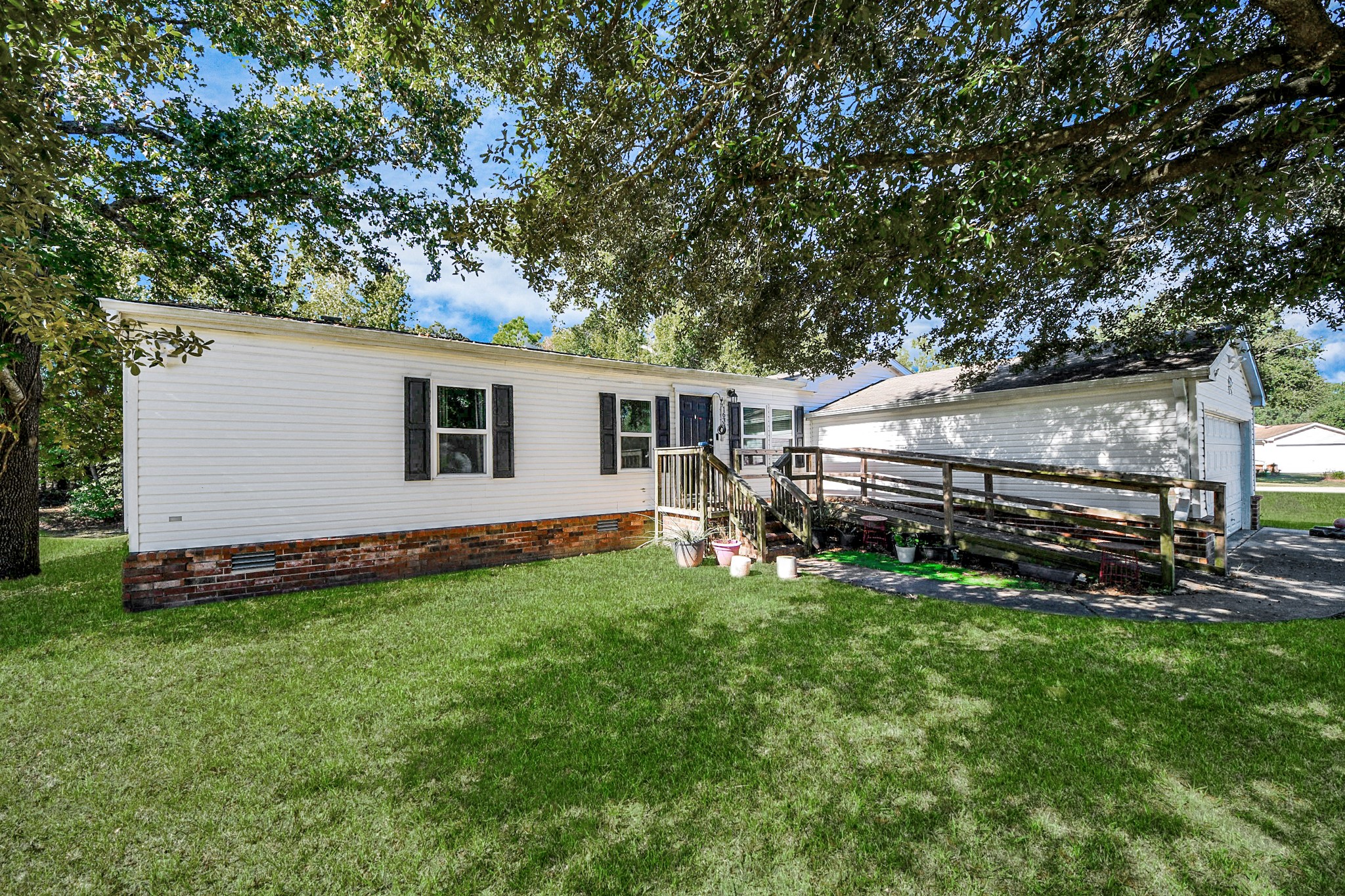 16338 Hill Country Court Conroe, TX 77302 - Photo 36 of 39 a view of a backyard with plants and large trees