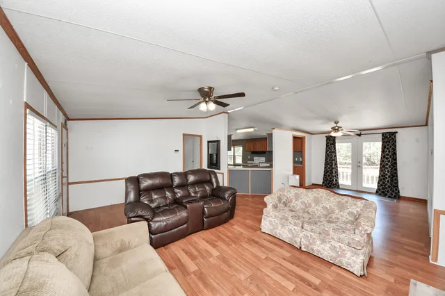 a bedroom with furniture and wooden floor