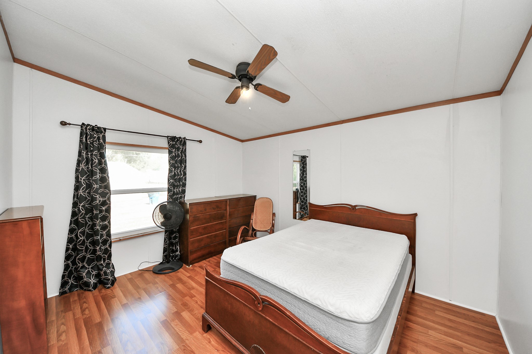 16338 Hill Country Court Conroe, TX 77302 - Photo 8 of 39 a bedroom with furniture and wooden floor