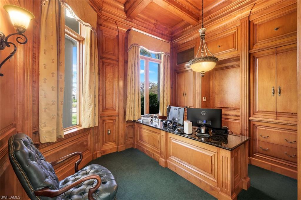 856 Inlet Drive Marco Island, FL 34145 - Photo 11 of 35 a kitchen with granite countertop a sink and a refrigerator