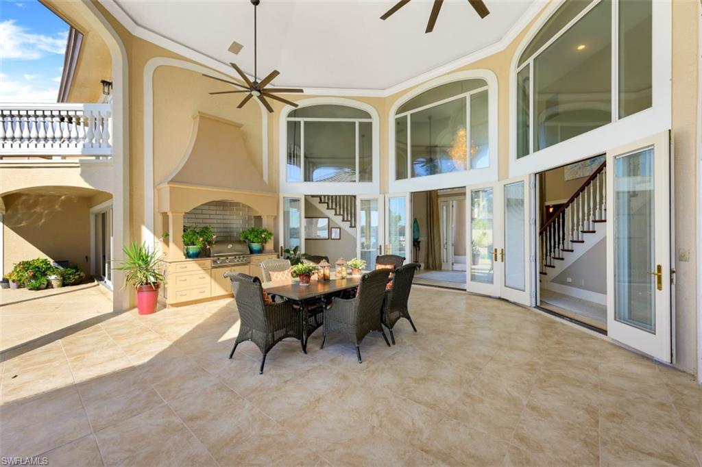 856 Inlet Drive Marco Island, FL 34145 - Photo 20 of 35 a view of a dining room with furniture window and wooden floor