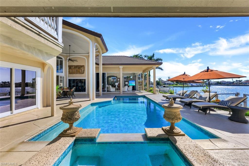 856 Inlet Drive Marco Island, FL 34145 - Photo 23 of 35 a living room with furniture and a table