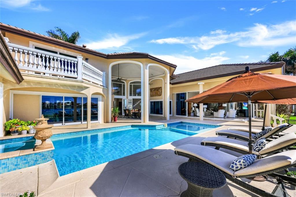 856 Inlet Drive Marco Island, FL 34145 - Photo 25 of 35 front view of a house with a yard