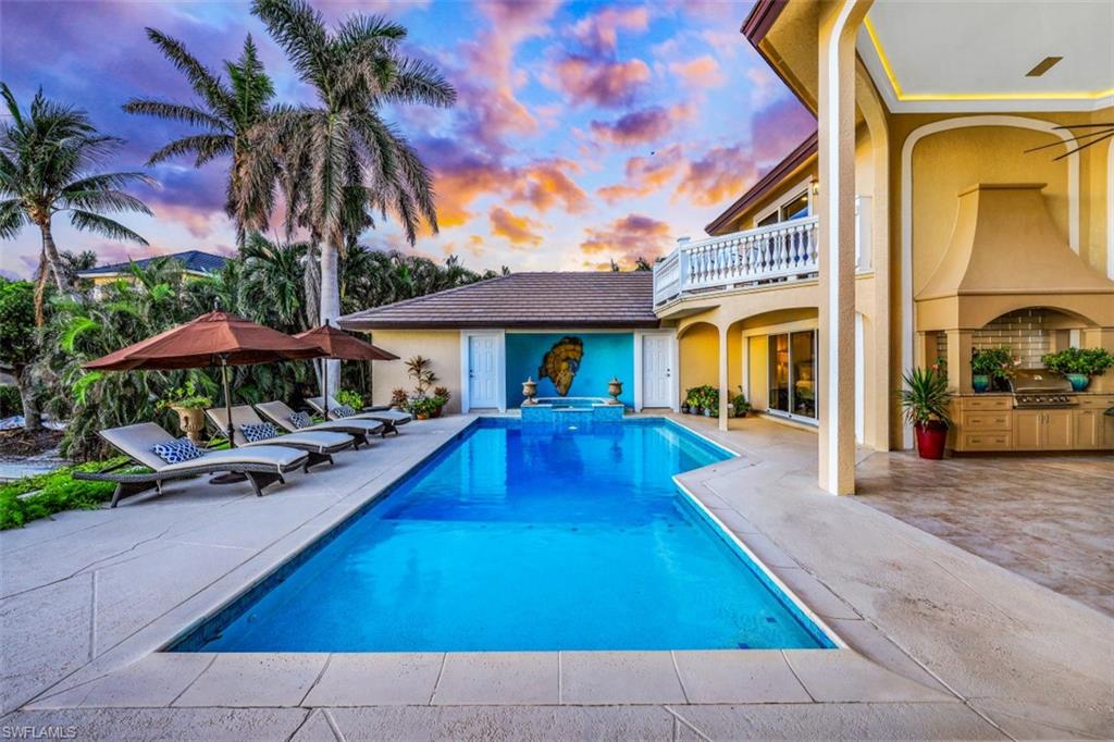 856 Inlet Drive Marco Island, FL 34145 - Photo 27 of 35 a view of an house with swimming pool and sitting area