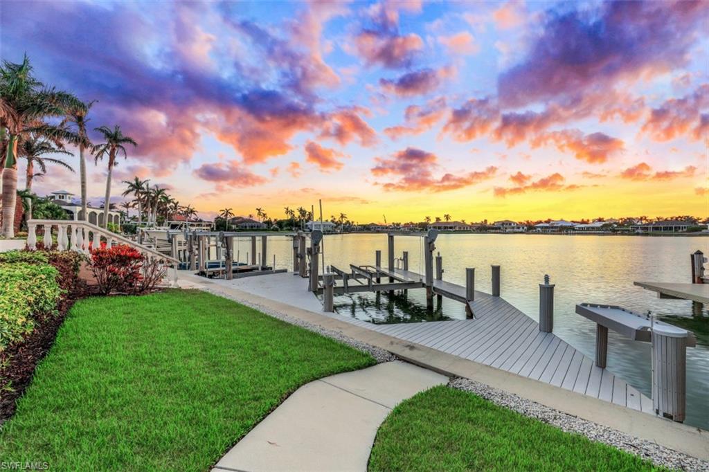 856 Inlet Drive Marco Island, FL 34145 - Photo 31 of 35 a view of a garden with sitting area