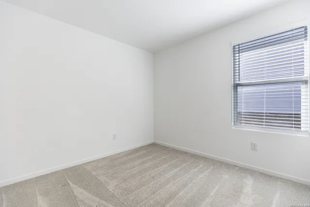 a view of a room that has a window in it