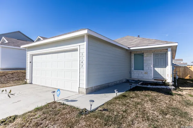 a house view with a backyard
