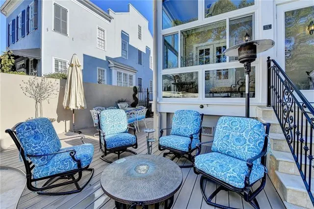 a living room with furniture potted plant and a window