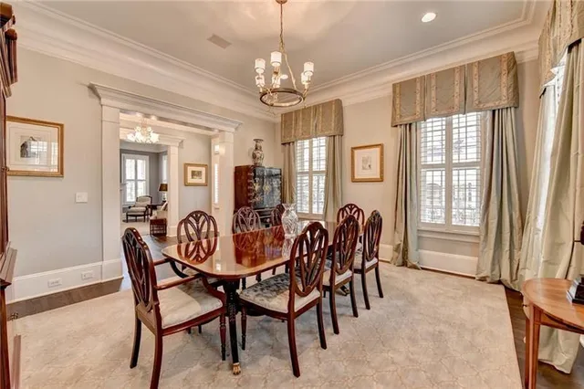 a kitchen with a counter space sink stove and wooden floor
