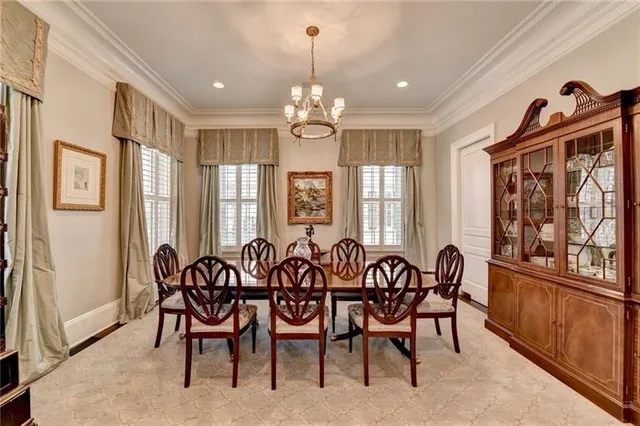 a view of a a dining room with furniture window and wooden floor